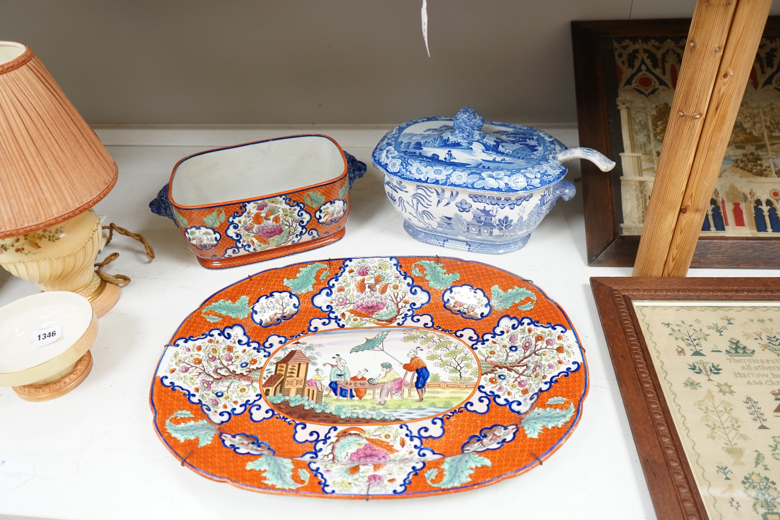 A large early to mid 19th century Pearlware meat platter and tureen without cover decorated with the ‘doctor calling’ pattern with a blue and white tureen cover and ladle, meat platter 54cm wide (3). Condition - fair